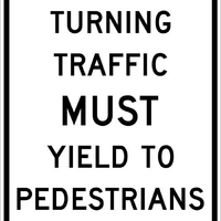 TURNING TRAFFIC MUST YIELD TO